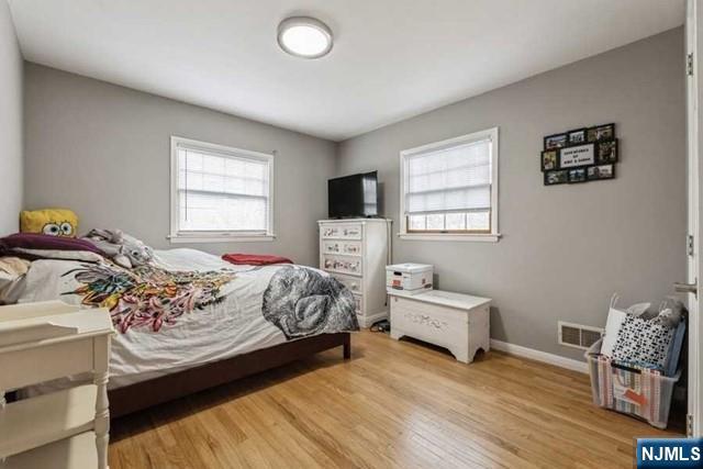 23 Asmus Road Closter, NJ 07624 - Photo 20 of 38 a bedroom with a bed and a window