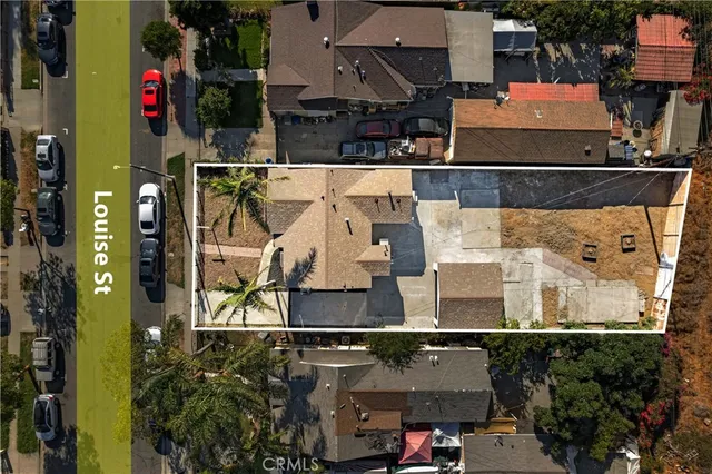 an aerial view of a house with a yard