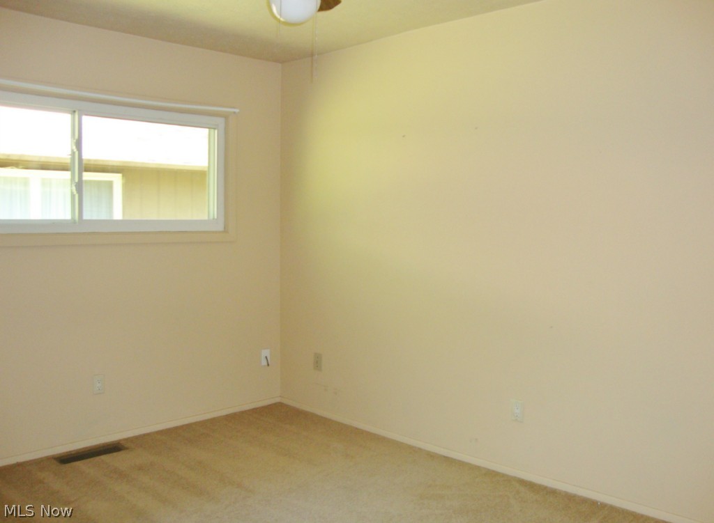 5698 Rock Point Circle North Ridgeville, OH 44039 - Photo 13 of 25 Bedroom 2 offers neutral carpet and walls.