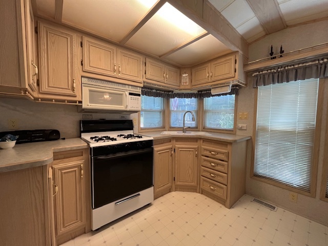 2795 East 28th Road Marseilles, IL 61341 - Photo 7 of 65 a kitchen with stainless steel appliances granite countertop a stove and a sink