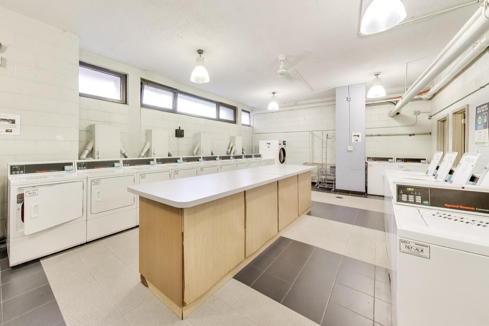 2930 North Sheridan Road, Unit 702 Chicago, IL 60657 - Photo 17 of 25 a kitchen with a sink stove and cabinets