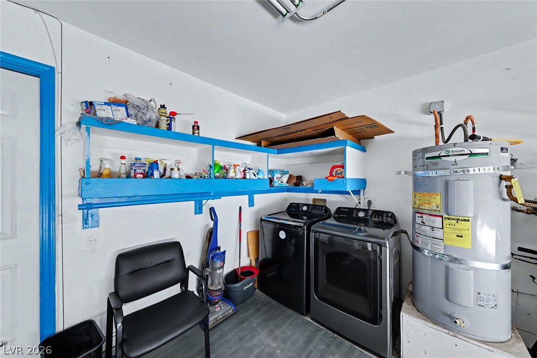 3107 Trueno Road Henderson, NV 89014 - Photo 29 of 37 A dedicated utility space offers practical storage and essential laundry facilities.