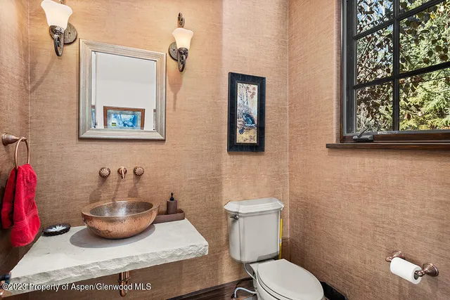a bathroom with a toilet and a sink