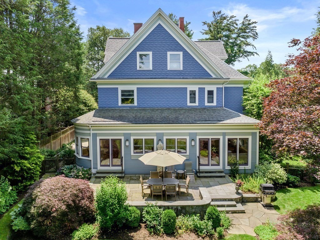 28 Monadnock Road Newton, MA 02467 - Photo 21 of 23 a front view of a house with a yard and potted plants