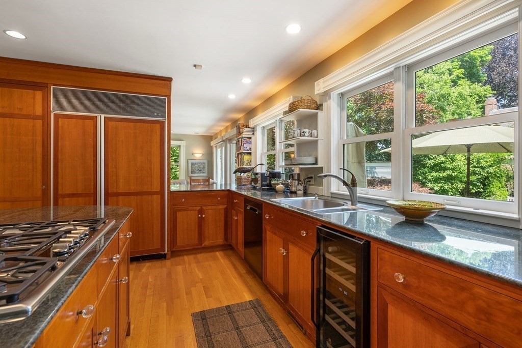 28 Monadnock Road Newton, MA 02467 - Photo 10 of 23 a kitchen with stainless steel appliances a sink stove and large window