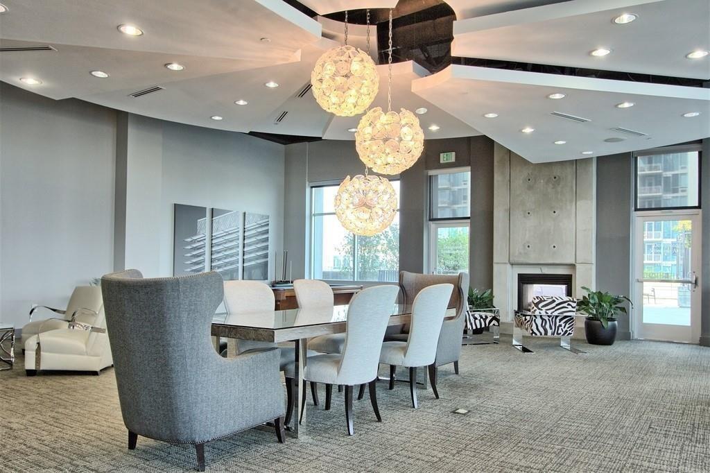 250 Pharr Road Northeast, Unit 601 Atlanta, GA 30305 - Photo 31 of 34 a view of a dining room with furniture and chandelier