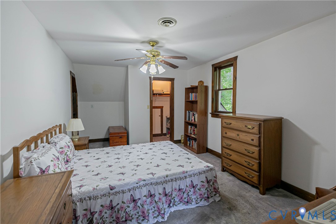 19321 River Road Chesterfield, VA 23838 - Photo 42 of 50 a bedroom with a bed and a dresser