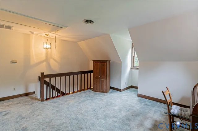 a view of an empty room with windows