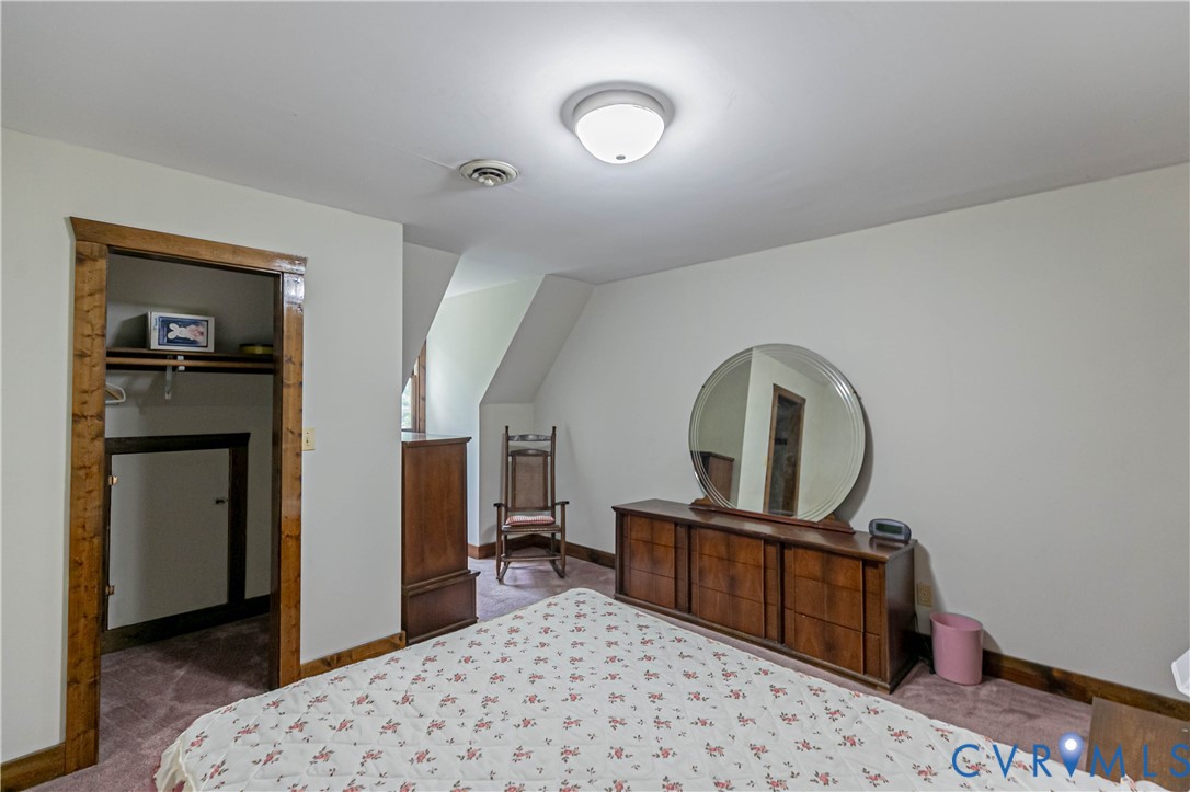 19321 River Road Chesterfield, VA 23838 - Photo 48 of 50 a bedroom with a bed and a dresser