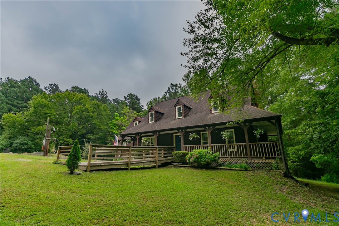 19321 River Road Chesterfield, VA 23838 - Photo 9 of 50 a front view of a house with a garden