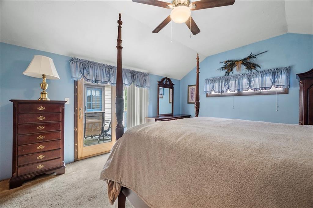 2033 McKees Rocks Road McKees Rocks, PA 15136 - Photo 21 of 33 a bedroom with a bed and a chandelier