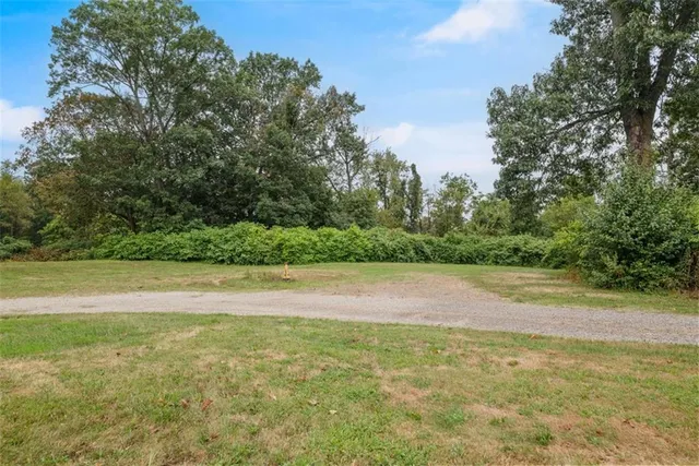a view of a yard with an outdoor space