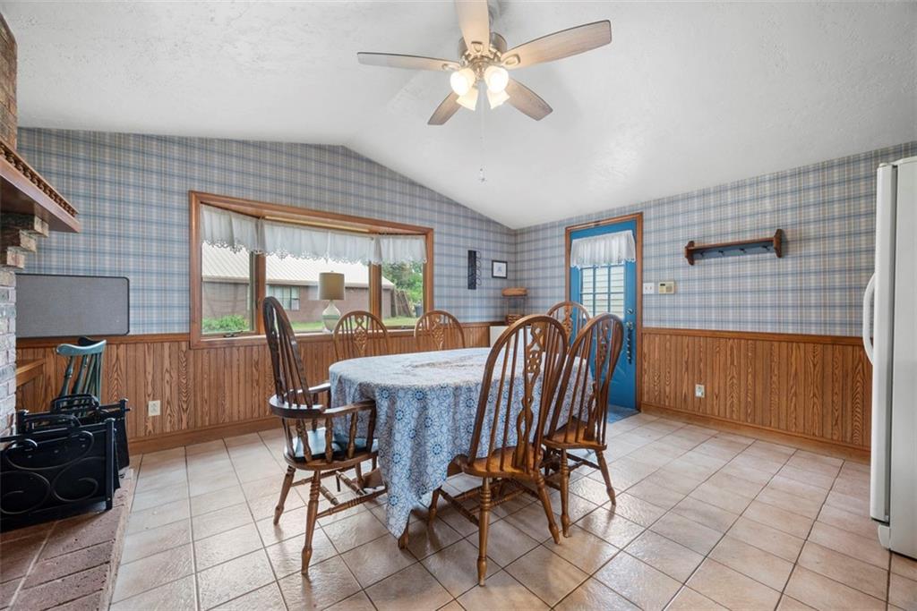 2033 McKees Rocks Road McKees Rocks, PA 15136 - Photo 4 of 33 a dining room with furniture a chandelier and a rug