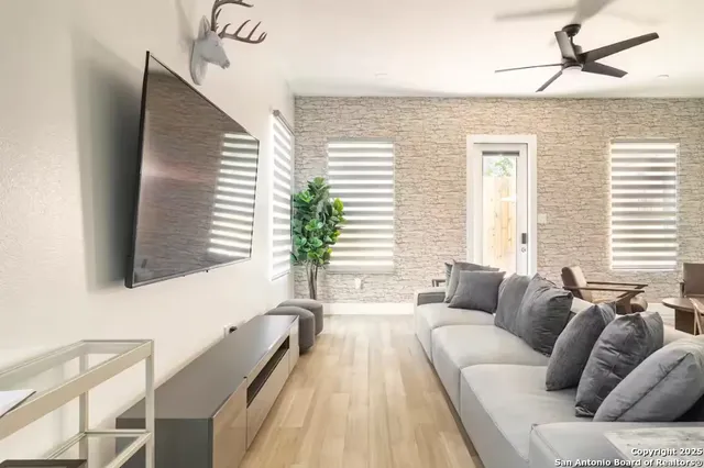 a living room with furniture and a large window