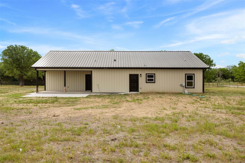 121 Brazier Road Ennis, TX 75119 - Photo 22 of 31 front view of a house with a yard