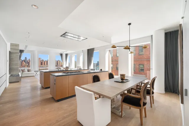 a kitchen with stainless steel appliances a stove sink and cabinets