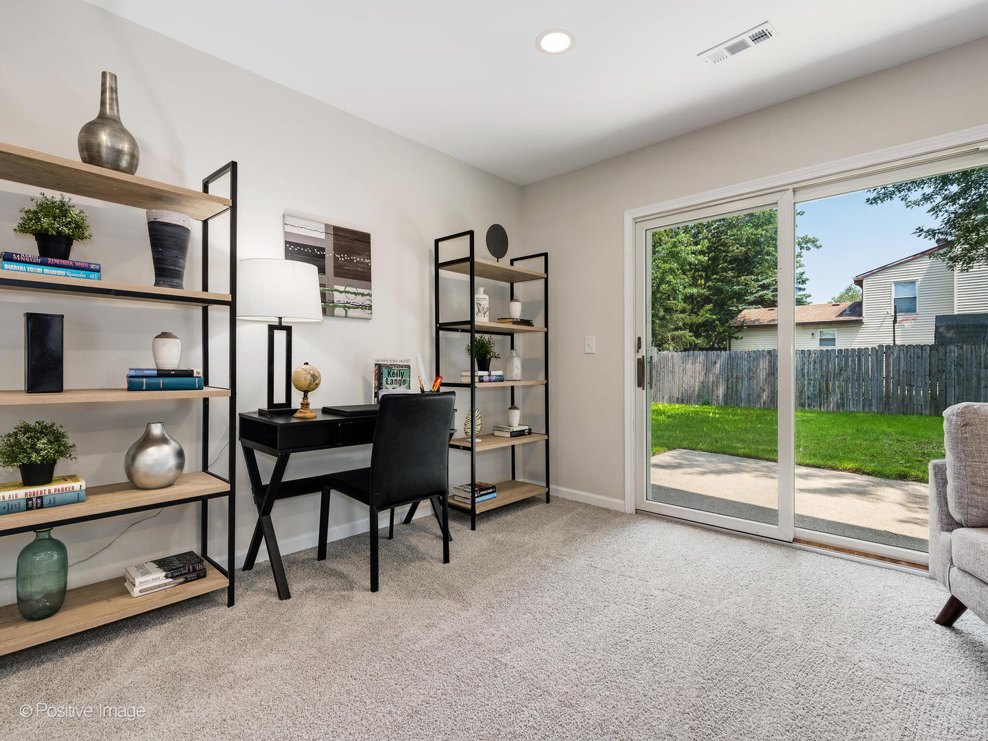 1475 Foxcroft Drive Aurora, IL 60506 - Photo 13 of 23 a view of a livingroom with furniture and a floor to ceiling window