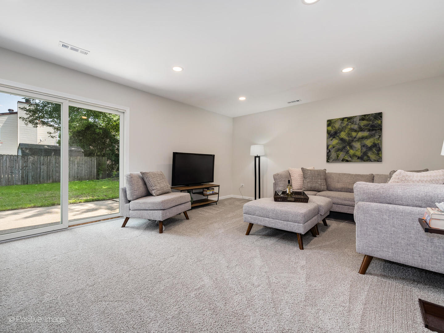 1475 Foxcroft Drive Aurora, IL 60506 - Photo 14 of 23 a living room with furniture and a flat screen tv