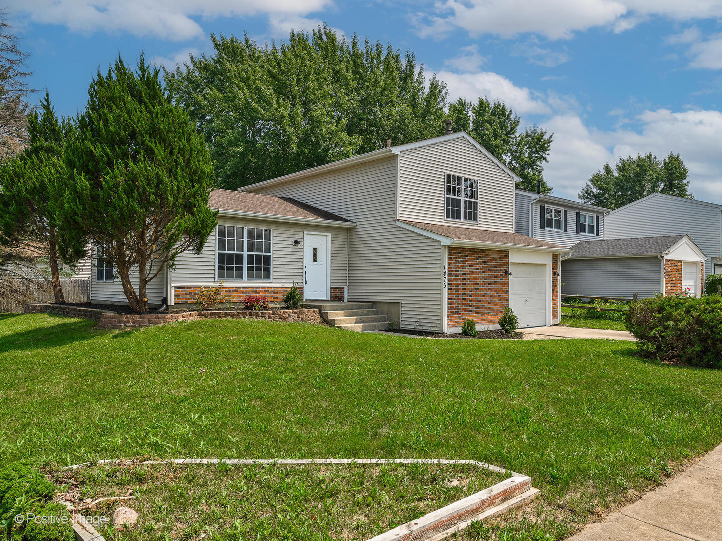 1475 Foxcroft Drive Aurora, IL 60506 - Photo 2 of 23 a front view of house with yard and green space