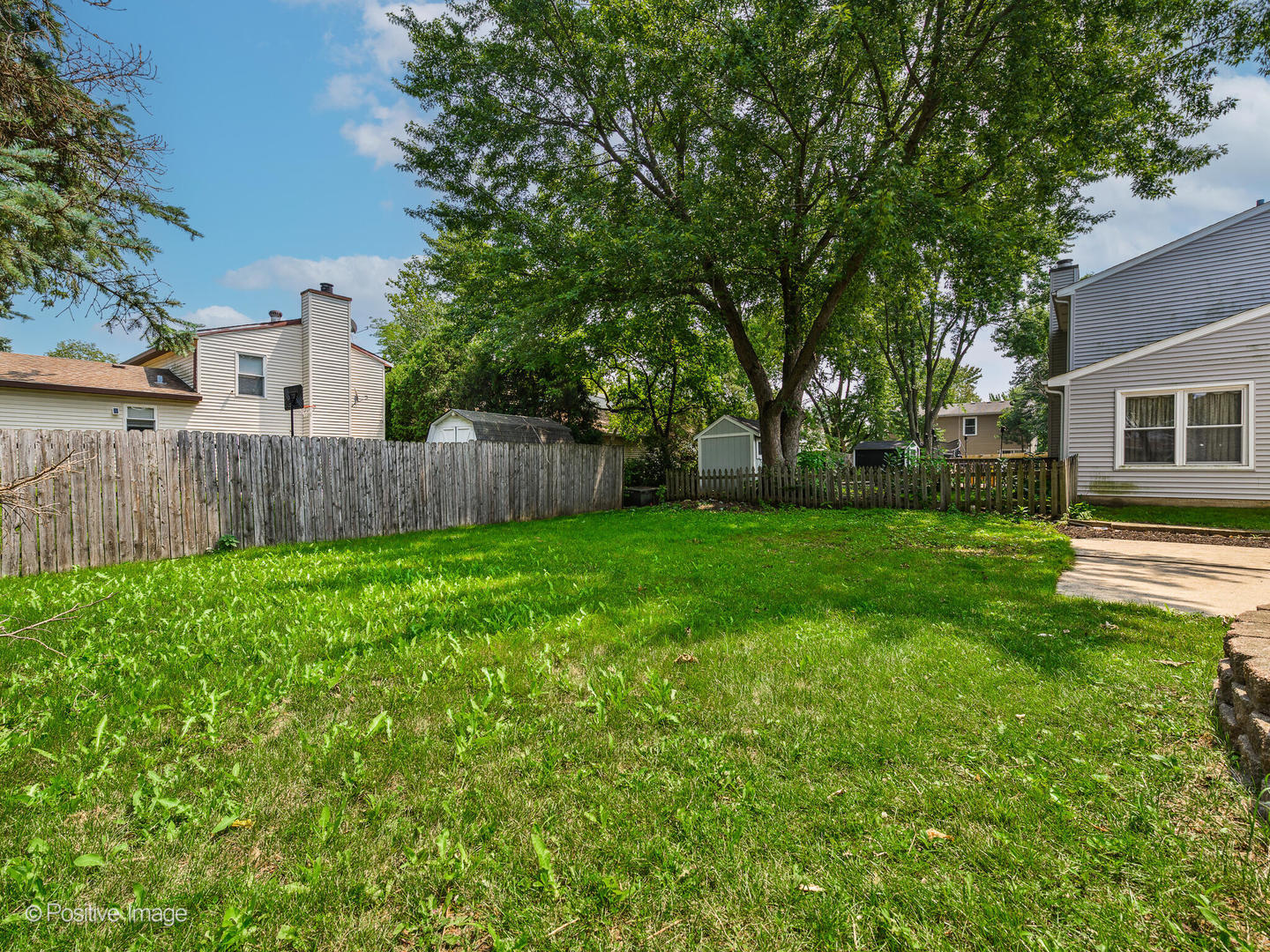1475 Foxcroft Drive Aurora, IL 60506 - Photo 22 of 23 a view of a backyard with a garden