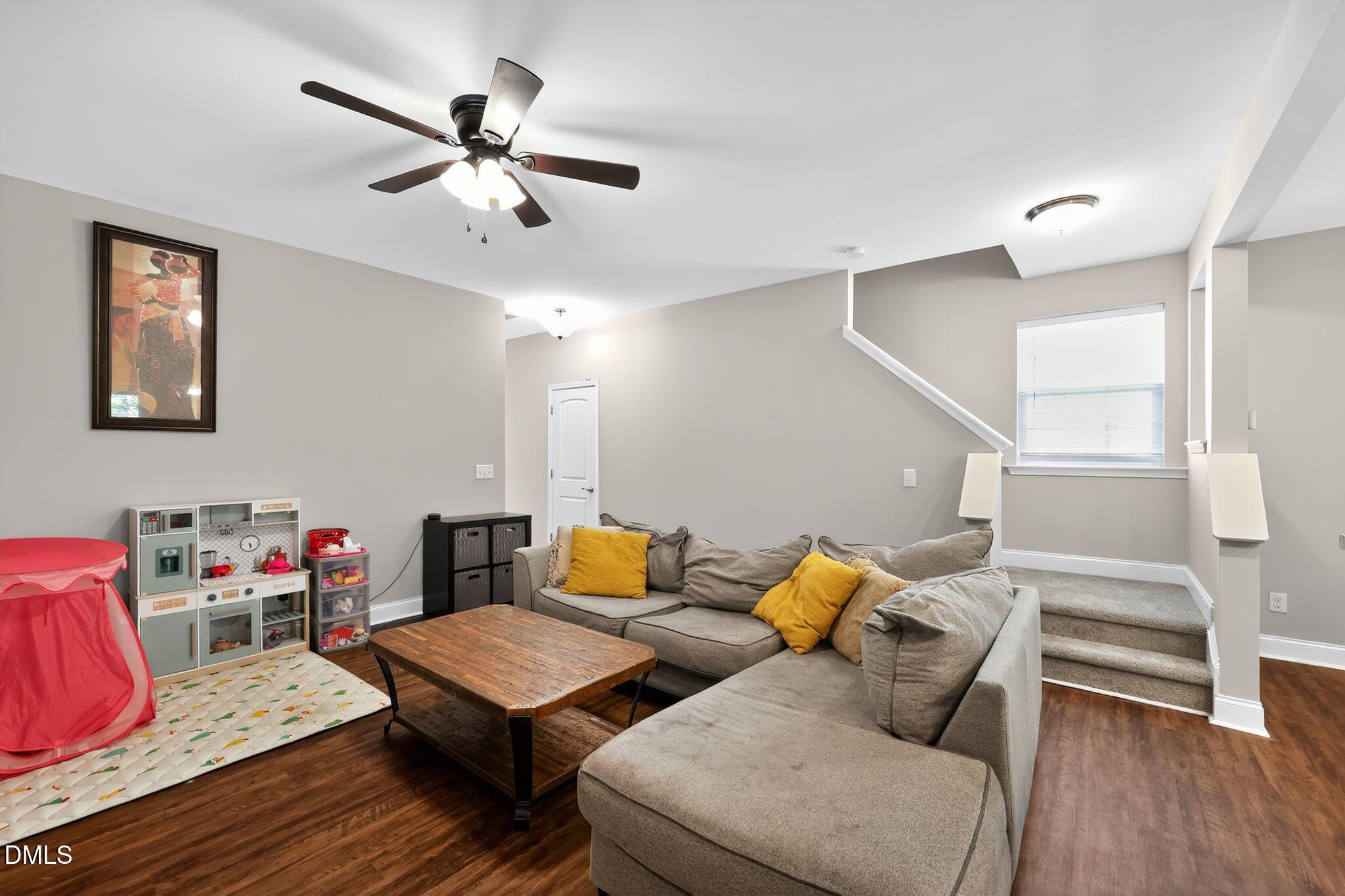 5721 Princess Curry Way Raleigh, NC 27610 - Photo 15 of 29 a living room with furniture and wooden floor