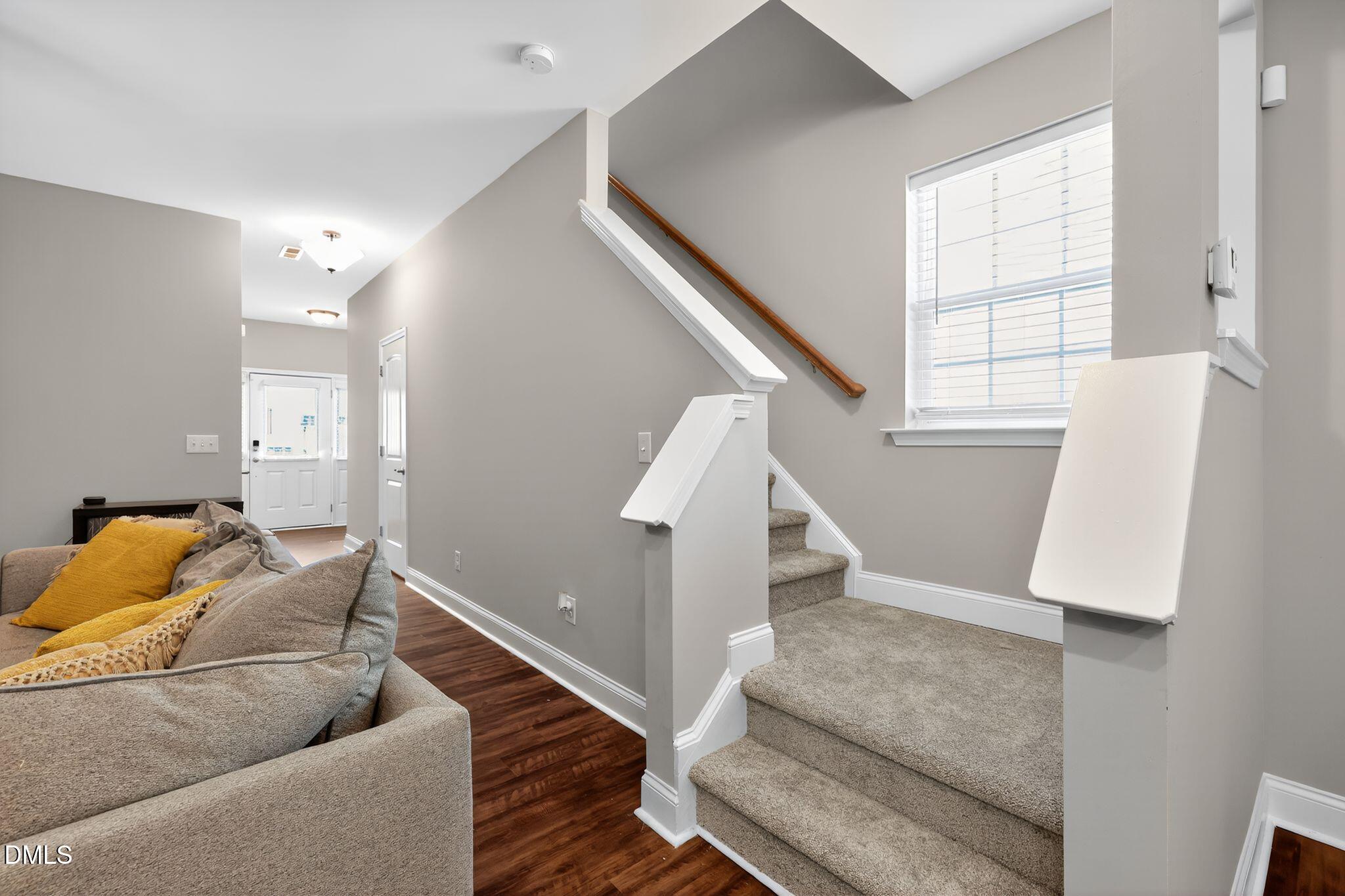 5721 Princess Curry Way Raleigh, NC 27610 - Photo 16 of 29 a living room with furniture and stairs