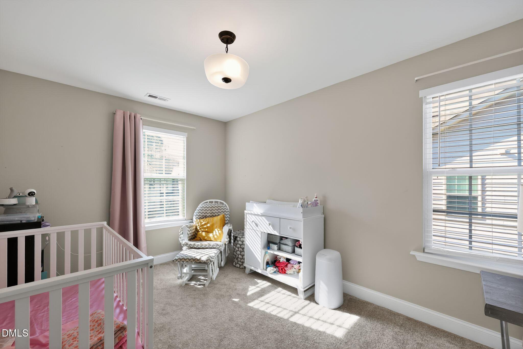 5721 Princess Curry Way Raleigh, NC 27610 - Photo 23 of 29 a living room with furniture and a window