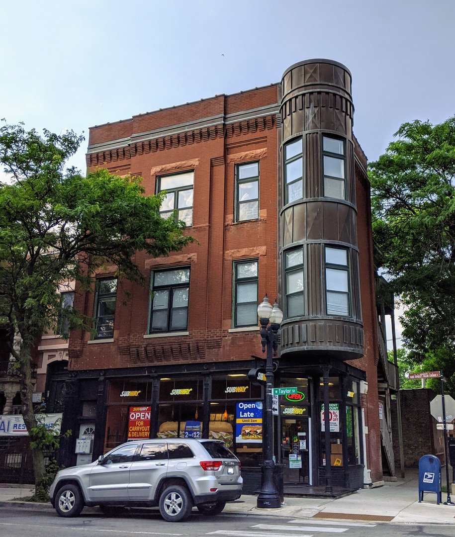1100 West Taylor Street, Unit 3F Chicago, IL 60607 - Photo 1 of 9 a car parked in front of a building