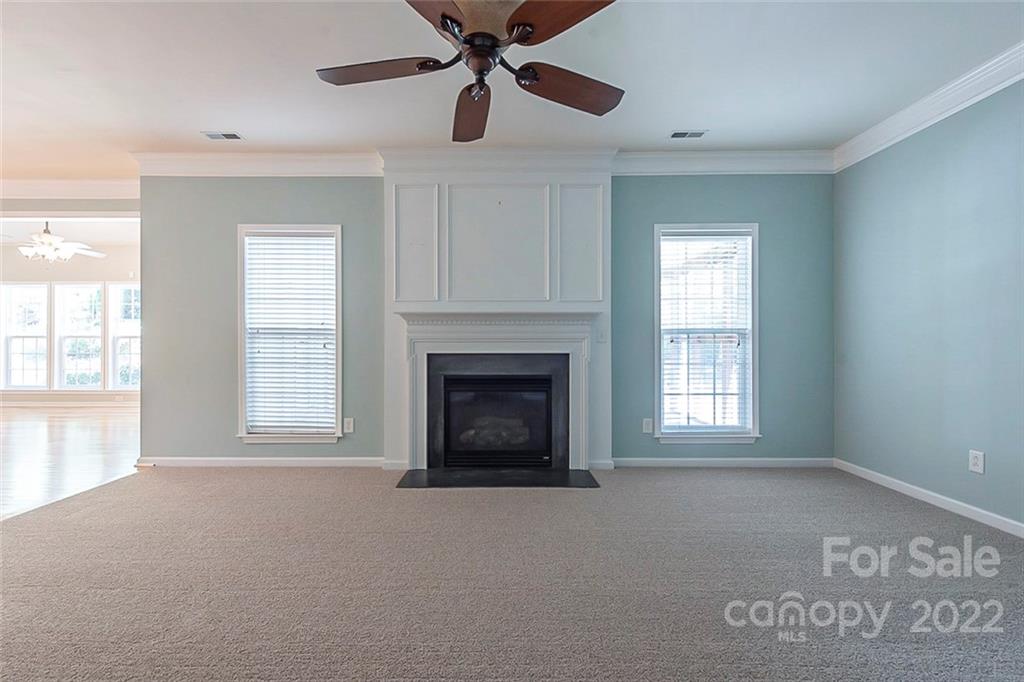 235 Choate Avenue Fort Mill, SC 29708 - Photo 3 of 21 a living room with a fireplace and a window
