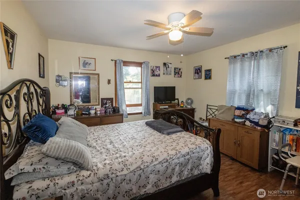 a view of a livingroom with workspace and a couch