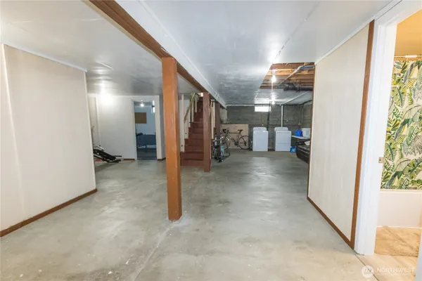 a view of a hallway with a view of living room