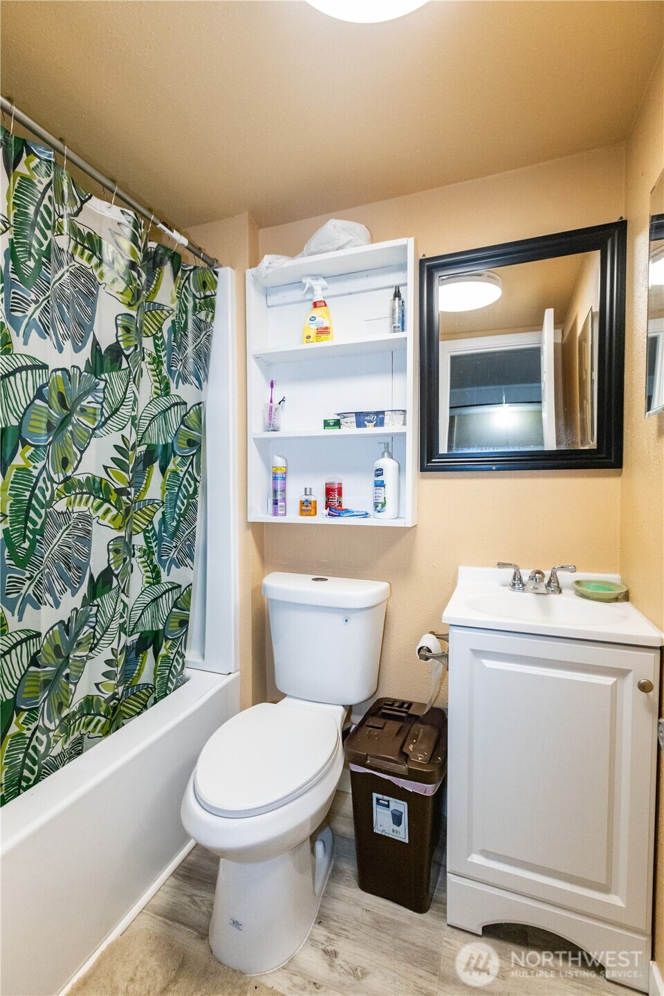 1107 South 4th Street Dayton, WA 99328 - Photo 23 of 31 a bathroom with a toilet a sink and a mirror
