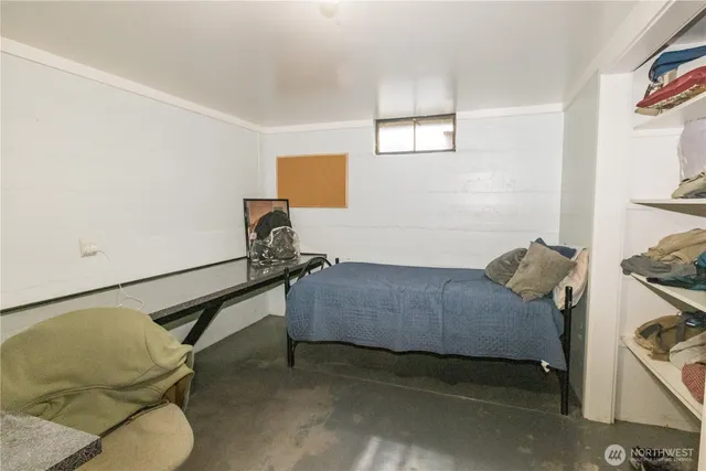 a bedroom with a bed and furniture