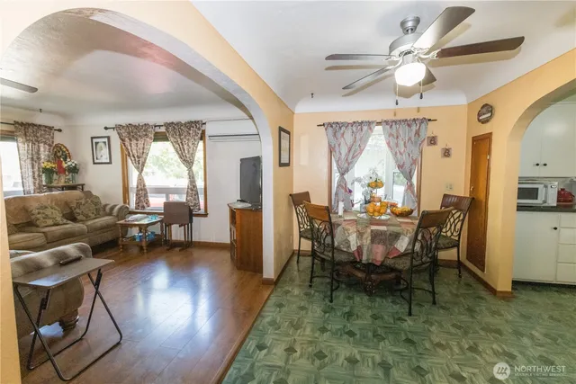 a view of a livingroom with furniture window and wooden floor