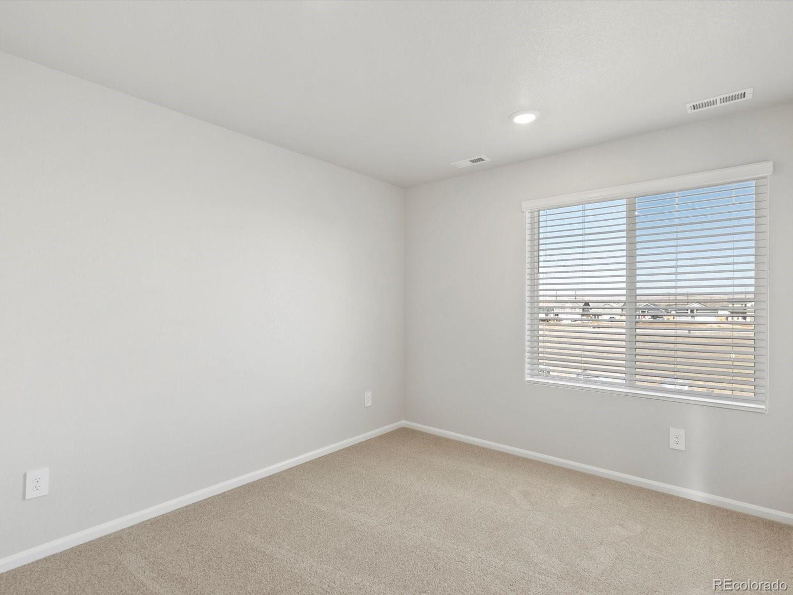 7335 West 27th Street Greeley, CO 80634 - Photo 14 of 25 an empty room with a window