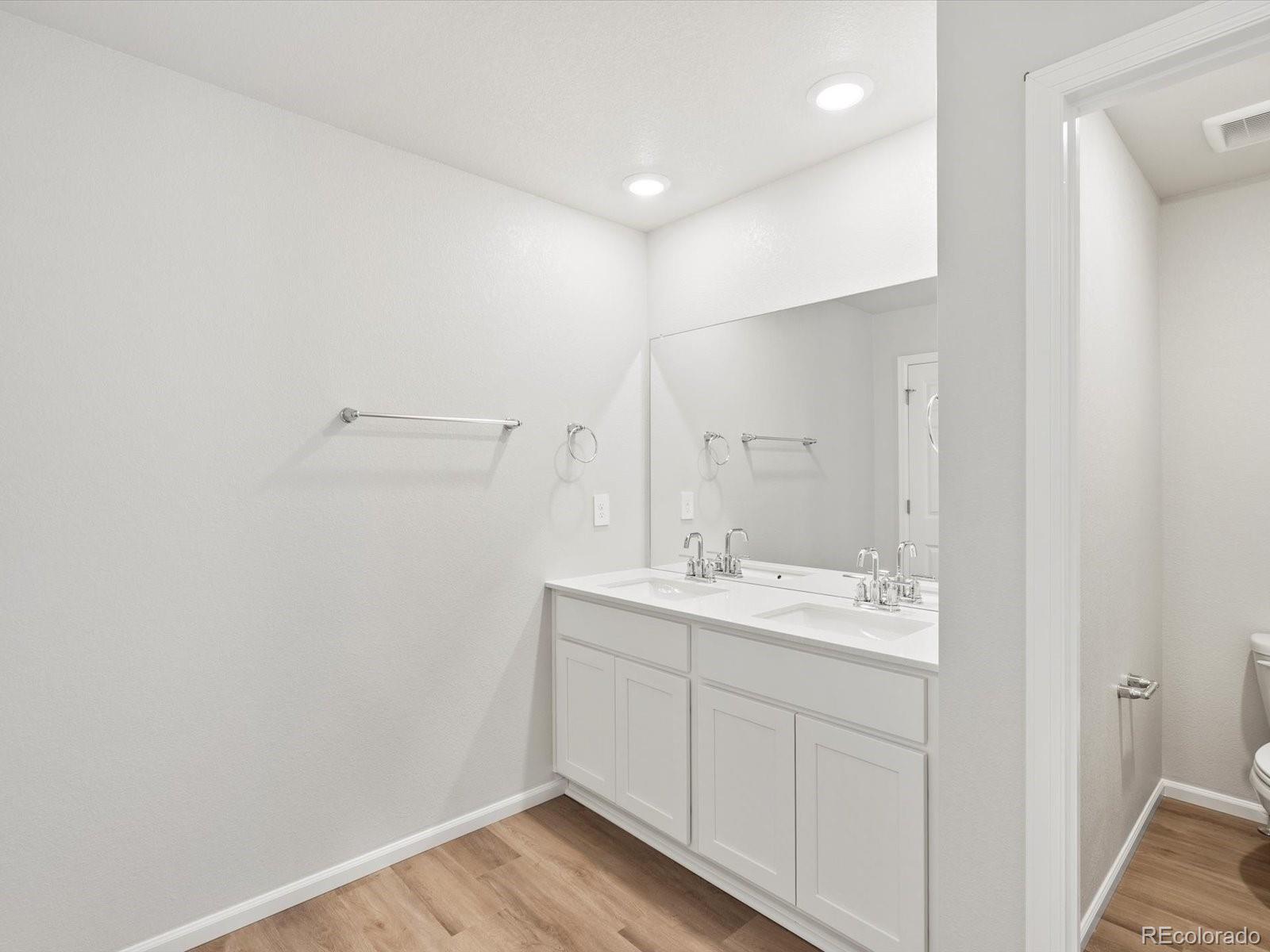 7335 West 27th Street Greeley, CO 80634 - Photo 19 of 25 a bathroom with a sink and a mirror
