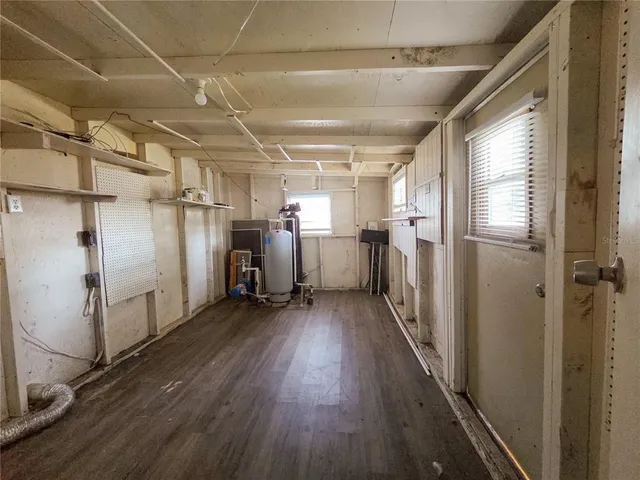 a view of a refrigerator in kitchen and wooden floor