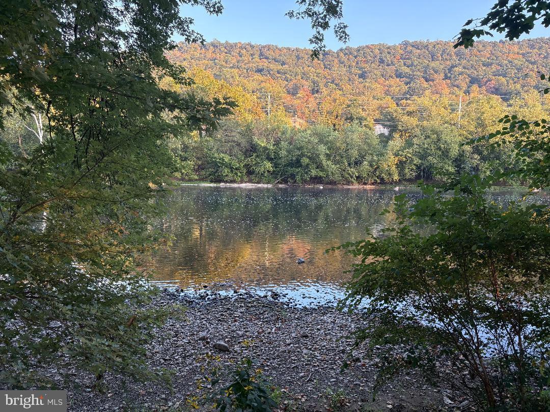 0 East River Road Lewistown, PA 17044 - Photo 3 of 14 a view of a lake with a mountain in the background
