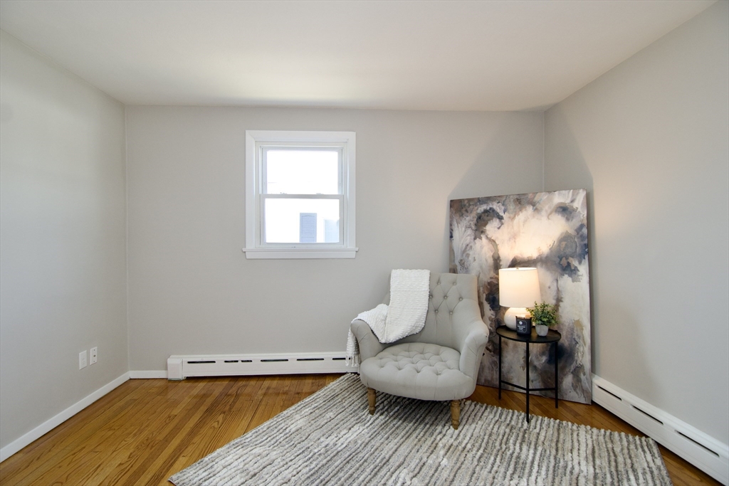 132 Lincoln Street West Springfield, MA 01089 - Photo 24 of 42 a living room with furniture and a wooden floor