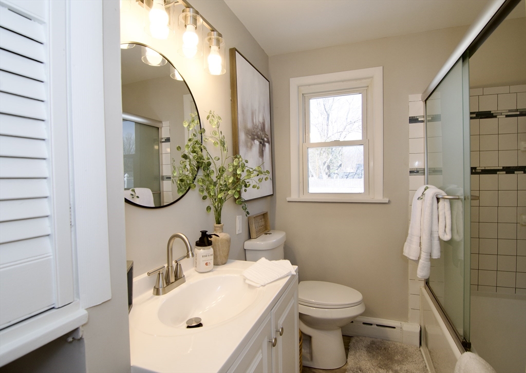 132 Lincoln Street West Springfield, MA 01089 - Photo 26 of 42 a bathroom with a sink vanity mirror and toilet
