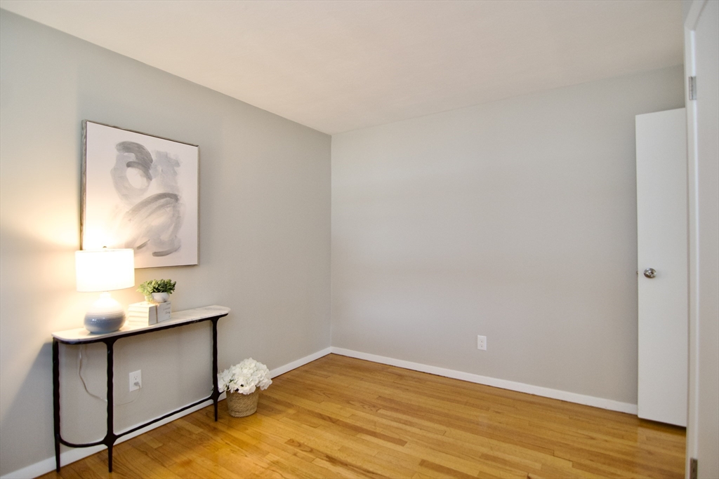 132 Lincoln Street West Springfield, MA 01089 - Photo 28 of 42 a view of room with window and wooden floor