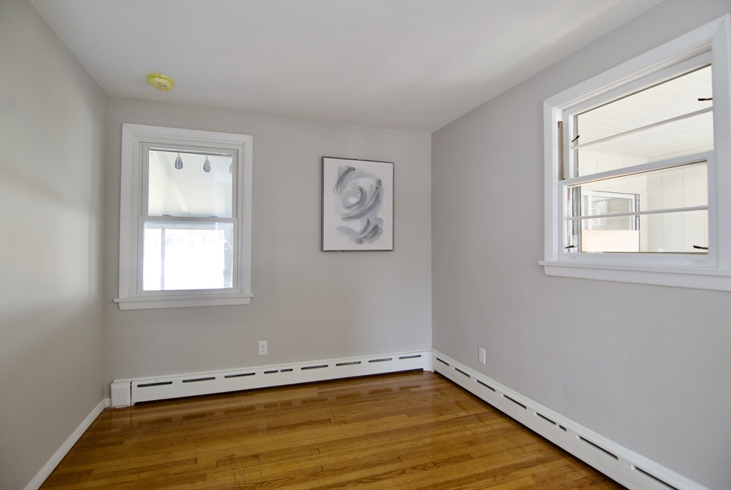 132 Lincoln Street West Springfield, MA 01089 - Photo 31 of 42 a view of a room with rack on the wall and a window
