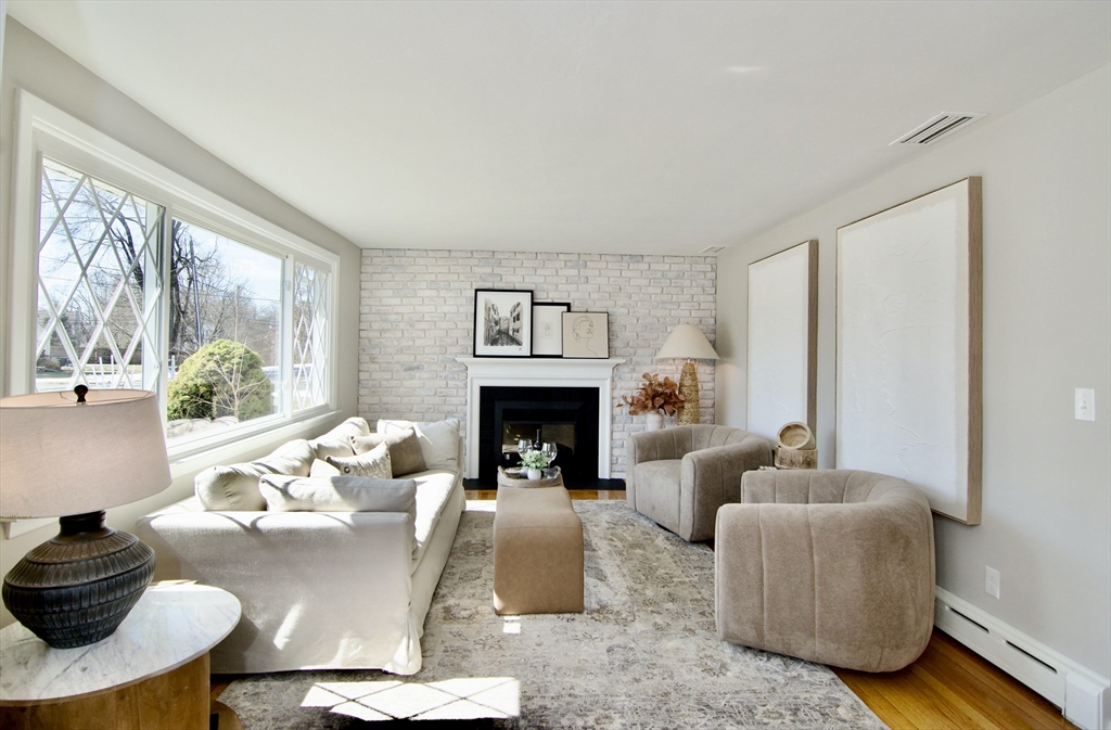 132 Lincoln Street West Springfield, MA 01089 - Photo 4 of 42 a living room with furniture and a fireplace