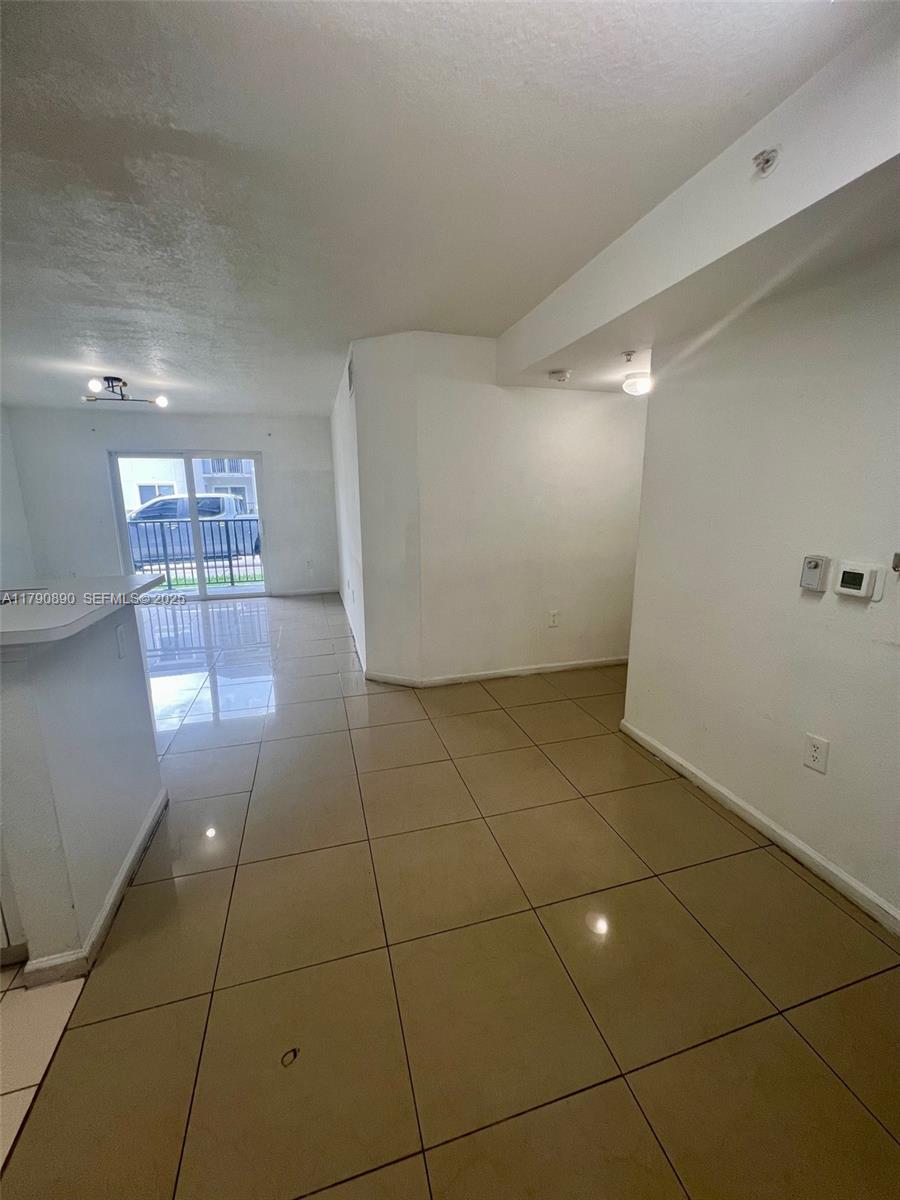 15422 Southwest 284th Street, Unit 7104 Homestead, FL 33033 - Photo 11 of 31 a view of a livingroom with an empty space and a sink