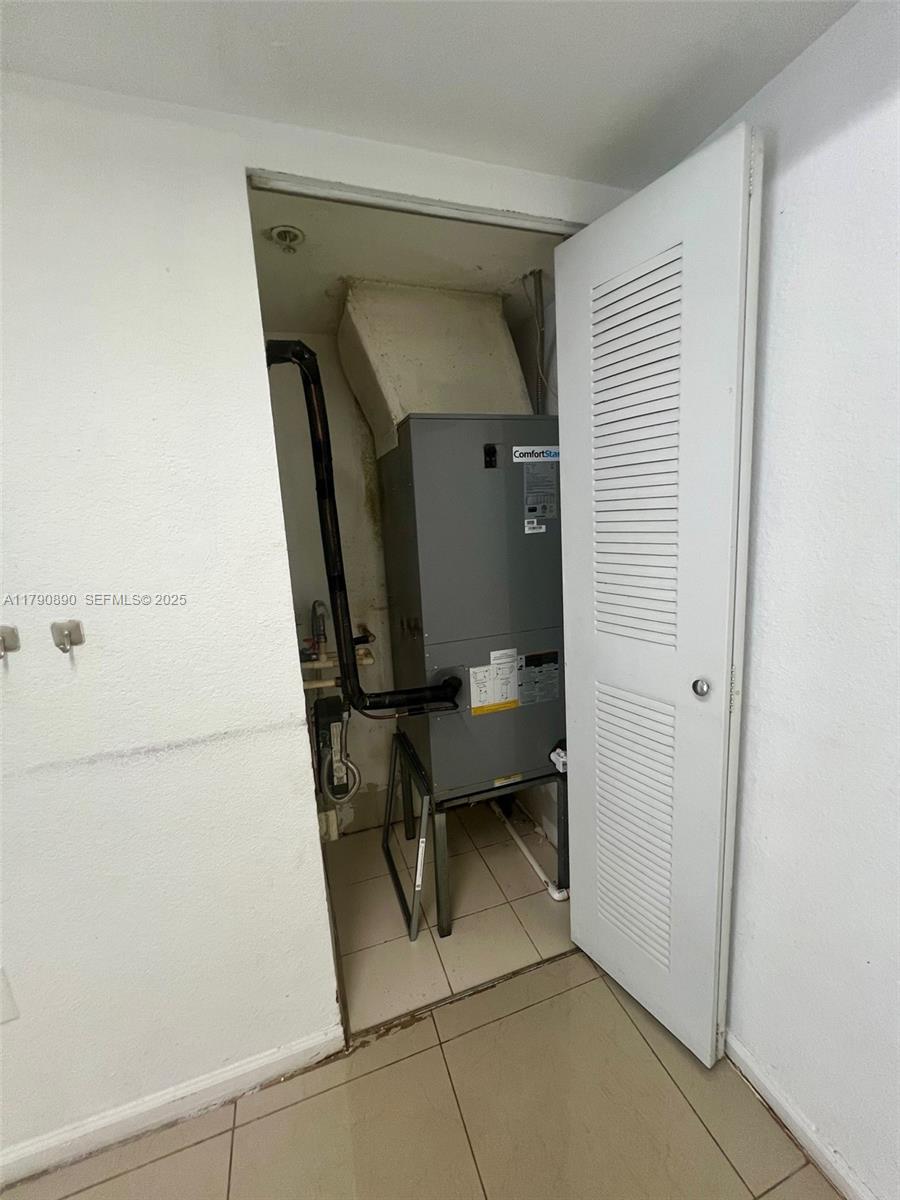 15422 Southwest 284th Street, Unit 7104 Homestead, FL 33033 - Photo 12 of 31 a utility room with dryer and washer