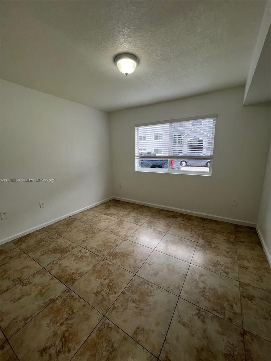 15422 Southwest 284th Street, Unit 7104 Homestead, FL 33033 - Photo 13 of 31 a view of room with window