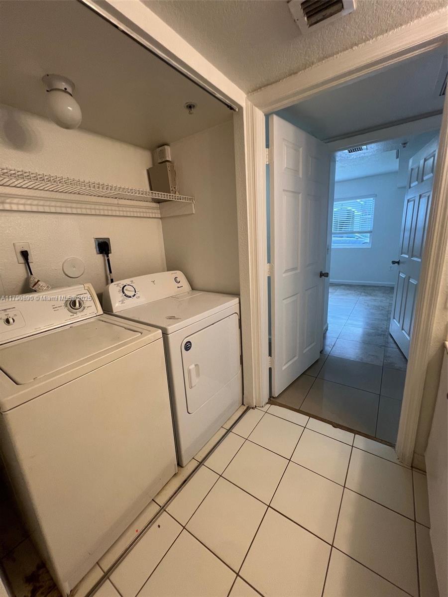 15422 Southwest 284th Street, Unit 7104 Homestead, FL 33033 - Photo 16 of 31 a utility room with dryer and washer