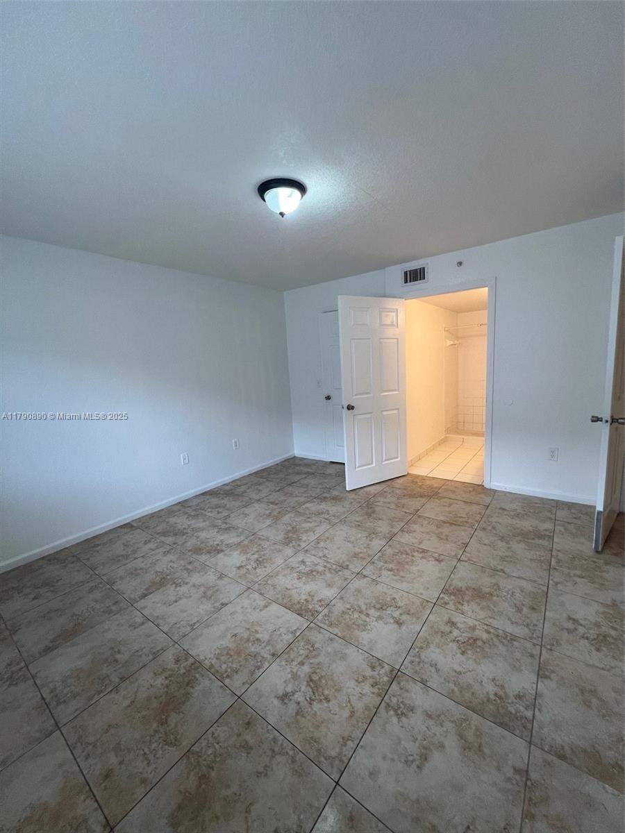 15422 Southwest 284th Street, Unit 7104 Homestead, FL 33033 - Photo 20 of 31 an empty room with a natural light