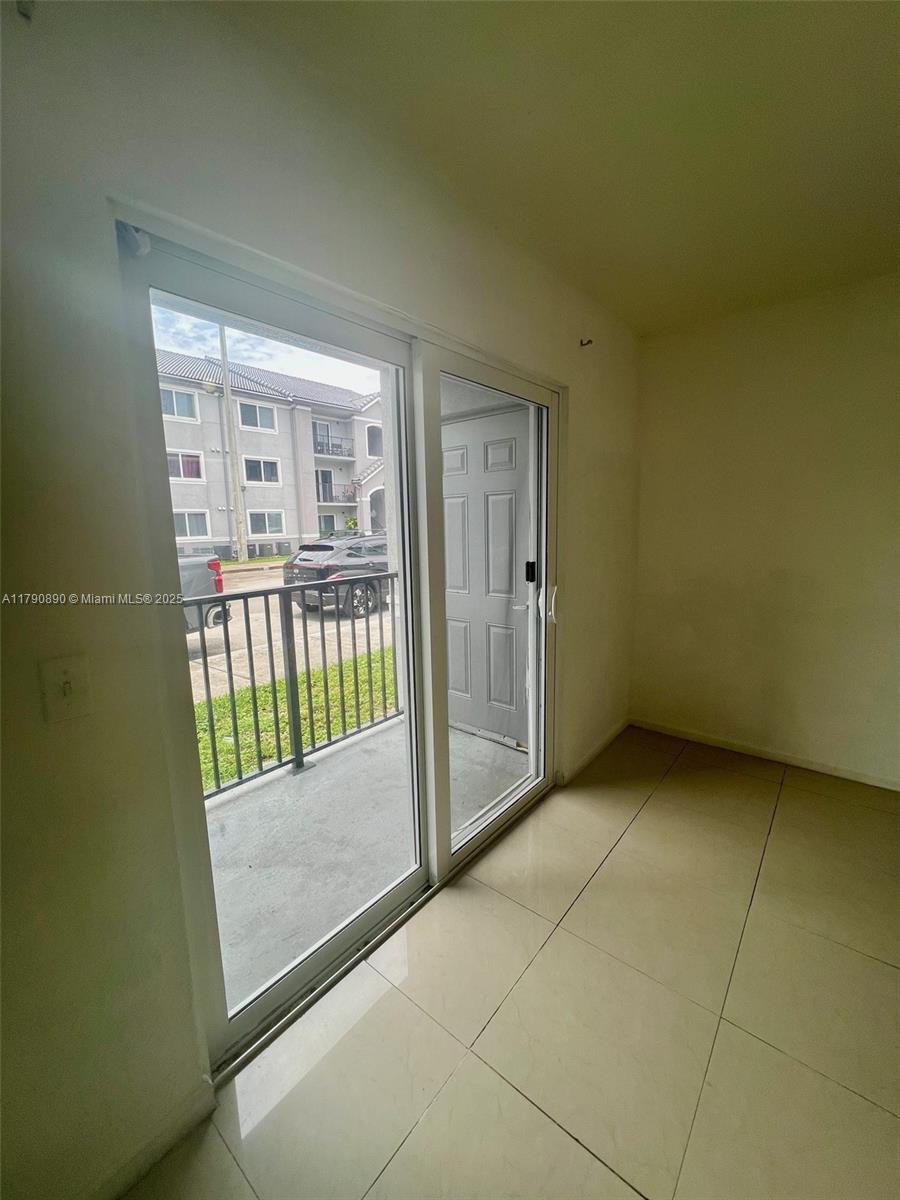 15422 Southwest 284th Street, Unit 7104 Homestead, FL 33033 - Photo 24 of 31 a view of a room that has a large window