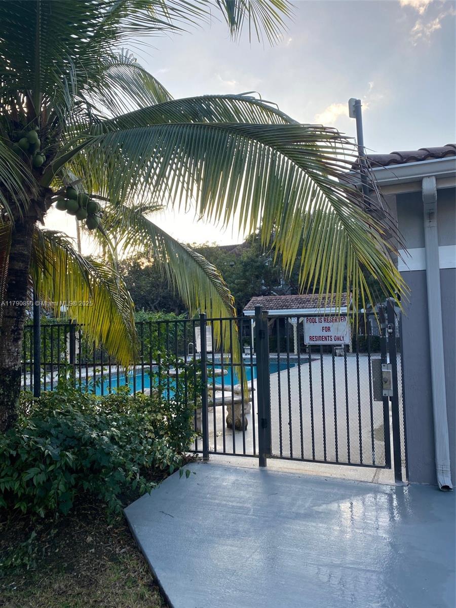 15422 Southwest 284th Street, Unit 7104 Homestead, FL 33033 - Photo 28 of 31 a view of a backyard and a garden
